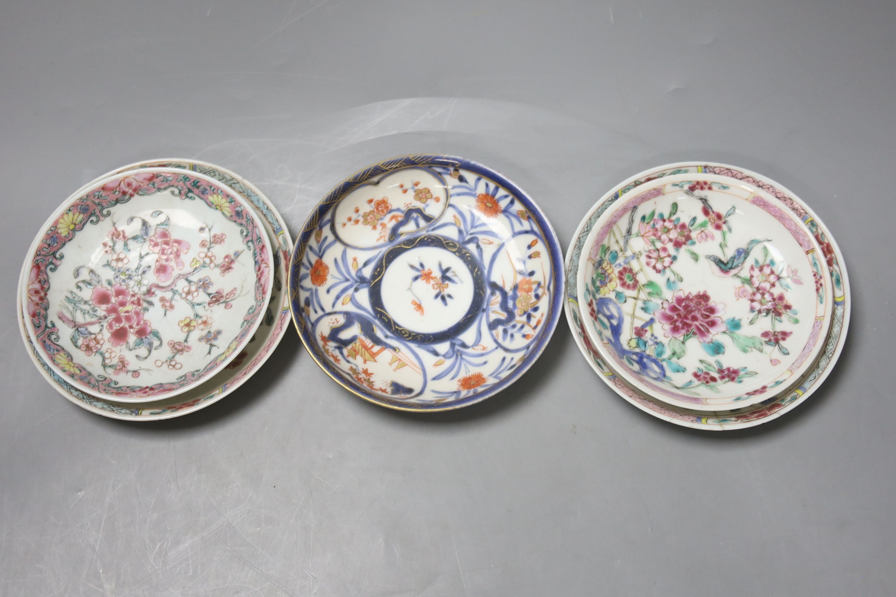 Three 18th century Chinese famille rose or Imari tea bowls together with five saucers